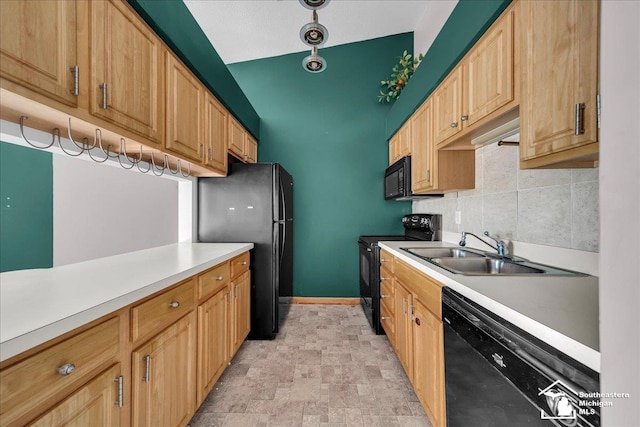 15795 Lakeside Dr, Southgate, MI 48195 - kitchen with black appliances, a sink, light countertops, baseboards, and stone finish flooring