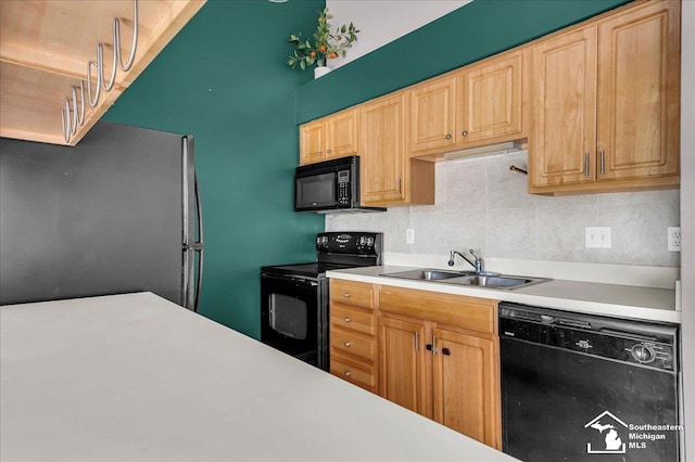 15795 Lakeside Dr, Southgate, MI 48195 - kitchen with black appliances, light countertops, a sink, decorative backsplash, and light brown cabinets