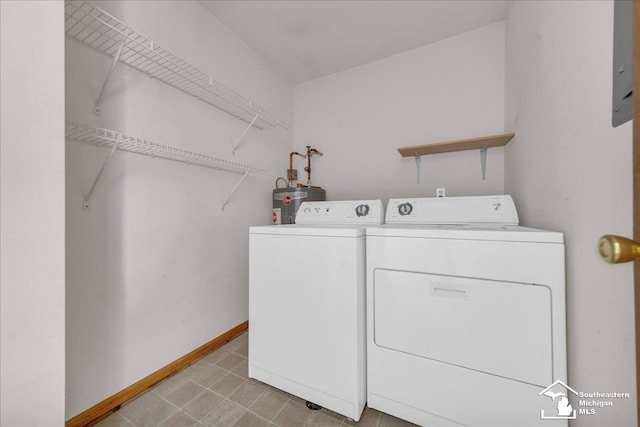 15795 Lakeside Dr, Southgate, MI 48195 - washroom with washer and dryer, baseboards, and gas water heater