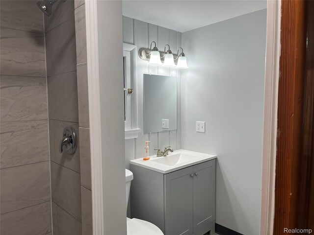 478 Karcher Rd, Rose City, MI 48654 - bathroom with tiled shower, vanity, and toilet