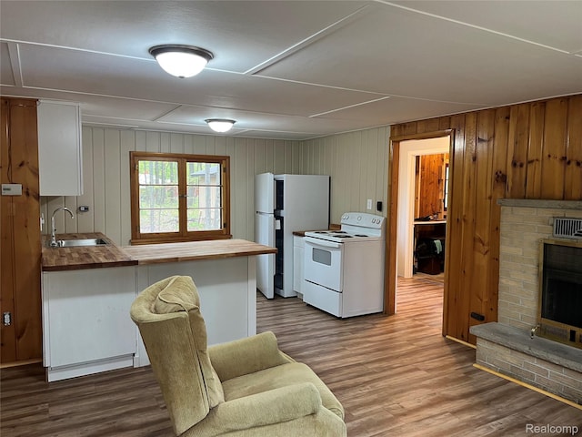 478 Karcher Rd, Rose City, MI 48654 - kitchen with white appliances, a sink, wood counters, dark wood finished floors, and wooden walls