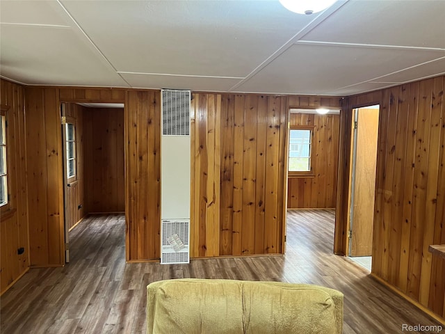 478 Karcher Rd, Rose City, MI 48654 - living area featuring a heating unit, wood finished floors, and wooden walls