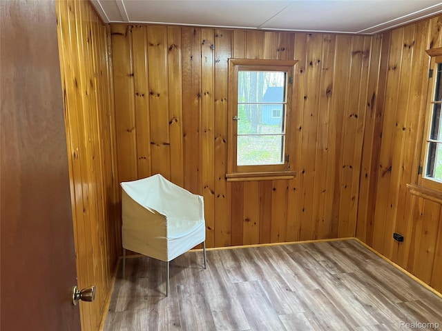 478 Karcher Rd, Rose City, MI 48654 - unfurnished room featuring wood finished floors, wooden walls, and baseboards