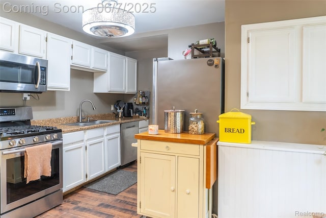 421 S Opdyke Rd, Auburn Hills, MI 48326 - kitchen featuring appliances with stainless steel finishes, a sink, dark wood-style flooring, and white cabinets