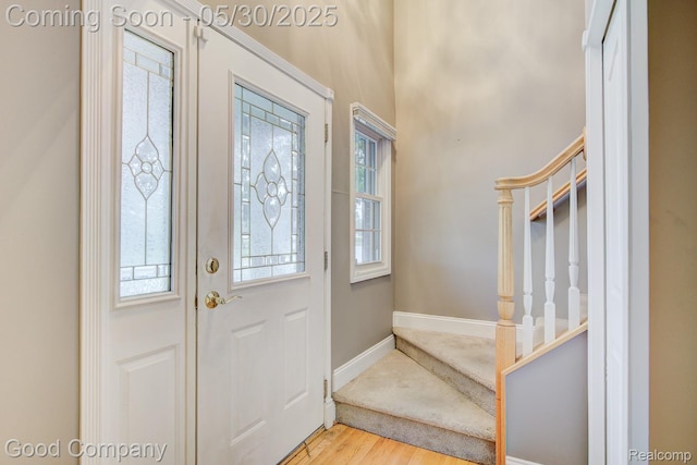1660 Normandy Rd, Clawson, MI 48017 - entryway featuring wood finished floors, stairs, healthy amount of natural light, and baseboards