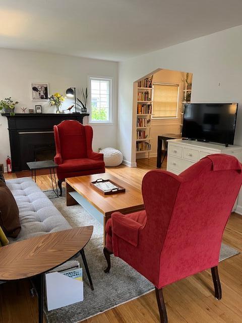 808 Princeton Ave, Ann Arbor, MI 48103 - living area with wood finished floors and a fireplace