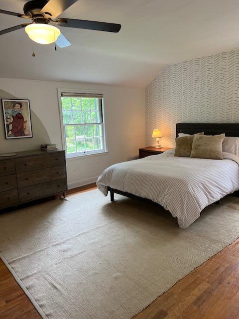 808 Princeton Ave, Ann Arbor, MI 48103 - bedroom featuring wood finished floors, a ceiling fan, and baseboards