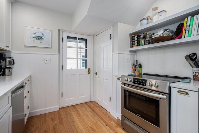 808 Princeton Ave, Ann Arbor, MI 48103 - kitchen with appliances with stainless steel finishes, light wood-style floors, light countertops, white cabinetry, and wainscoting