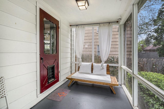 808 Princeton Ave, Ann Arbor, MI 48103 - sunroom with finished concrete flooring, wood walls, and healthy amount of natural light