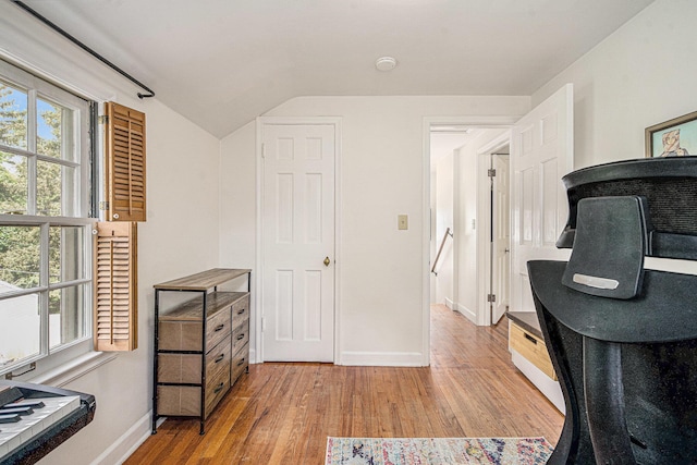 808 Princeton Ave, Ann Arbor, MI 48103 - home office with baseboards, light wood-style floors, and vaulted ceiling