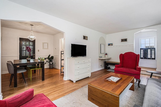 808 Princeton Ave, Ann Arbor, MI 48103 - living area with wood finished floors, arched walkways, and baseboards