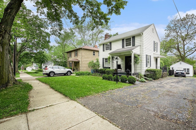 808 Princeton Ave, Ann Arbor, MI 48103 - view of front of home with a front lawn, covered porch, a chimney, and a garage