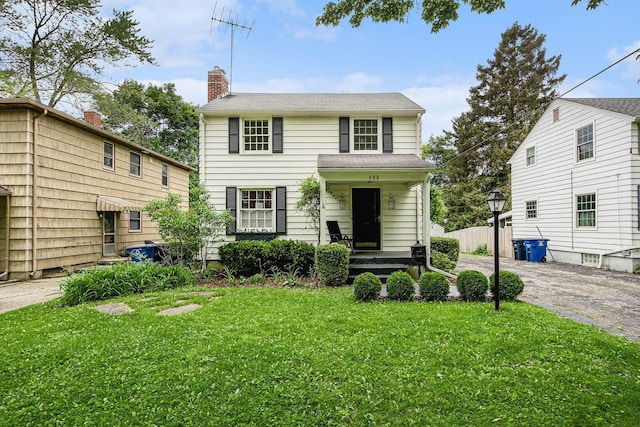 808 Princeton Ave, Ann Arbor, MI 48103 - view of front of property featuring a front lawn, a chimney, and covered porch