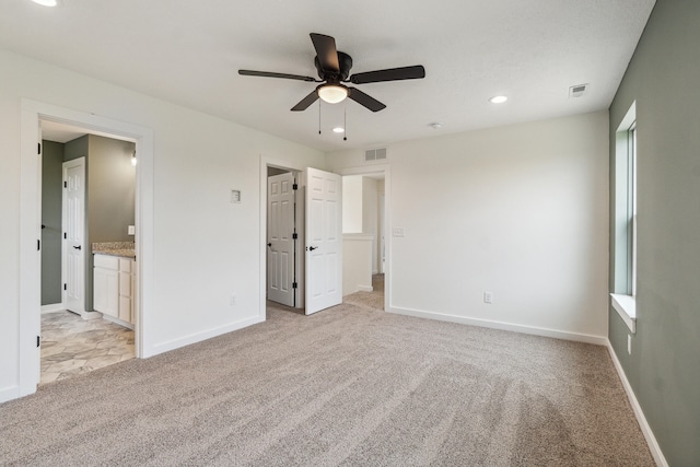 705 Montels Way, Charlotte, MI 48813 - unfurnished bedroom featuring light colored carpet, baseboards, recessed lighting, ensuite bathroom, and ceiling fan