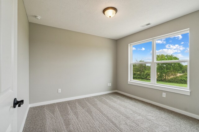 705 Montels Way, Charlotte, MI 48813 - unfurnished room with baseboards and carpet flooring