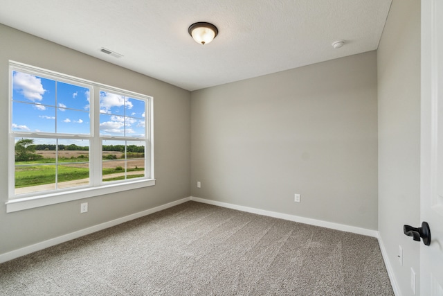 705 Montels Way, Charlotte, MI 48813 - unfurnished room featuring carpet, baseboards, and a smoke detector