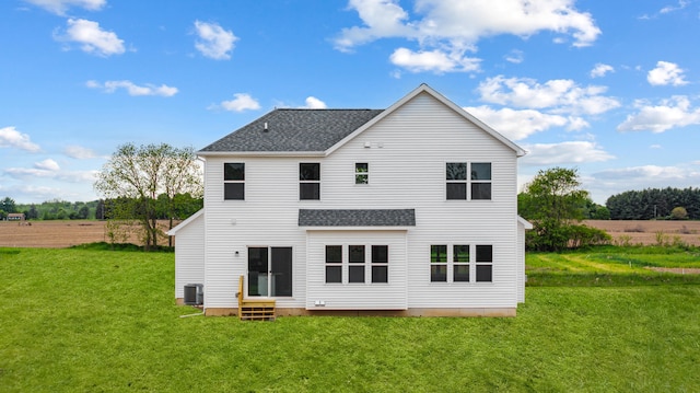 705 Montels Way, Charlotte, MI 48813 - back of house featuring entry steps, cooling unit, a lawn, and roof with shingles