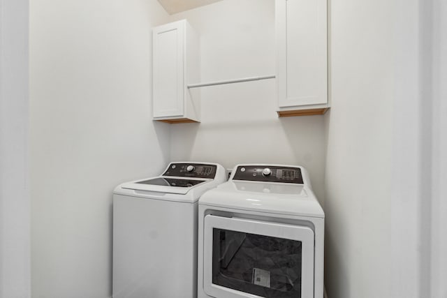 705 Montels Way, Charlotte, MI 48813 - washroom featuring independent washer and dryer and cabinet space