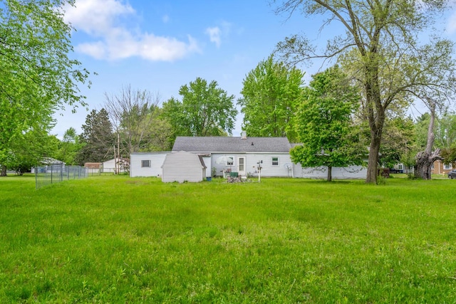 75 Taylor Ave, Battle Creek, MI 49037 - rear view of property featuring view of wooded area