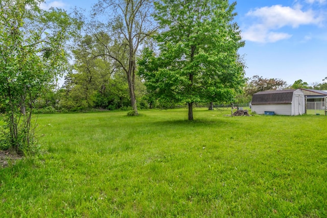 75 Taylor Ave, Battle Creek, MI 49037 - view of green lawn featuring an outdoor structure