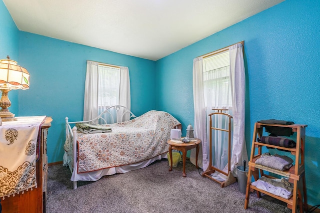 75 Taylor Ave, Battle Creek, MI 49037 - carpeted bedroom featuring multiple windows