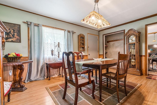 75 Taylor Ave, Battle Creek, MI 49037 - dining area with ornamental molding, light wood-style floors, and wainscoting
