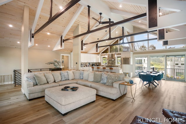 127 Emmet St, Grand Haven, MI 49417 - living room with wood ceiling with exposed beams, high vaulted ceiling, a ceiling fan, light wood-style floors, and recessed lighting