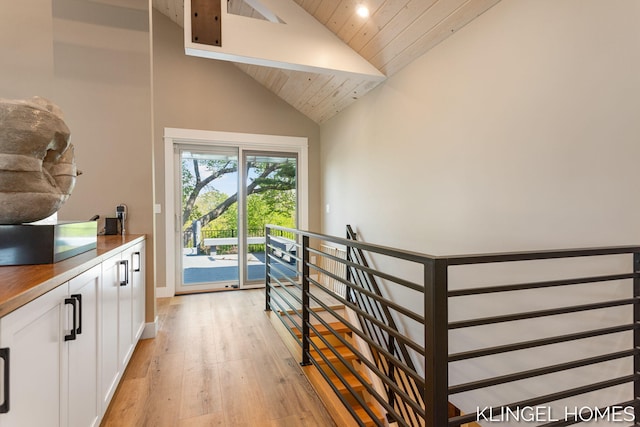 127 Emmet St, Grand Haven, MI 49417 - stairs featuring wood finished floors, high vaulted ceiling, wooden ceiling, baseboards, and recessed lighting