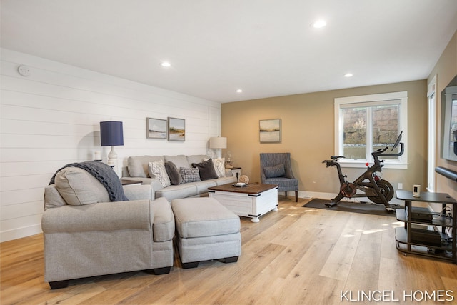 127 Emmet St, Grand Haven, MI 49417 - living room featuring light wood-style flooring, recessed lighting, baseboards, and wooden walls
