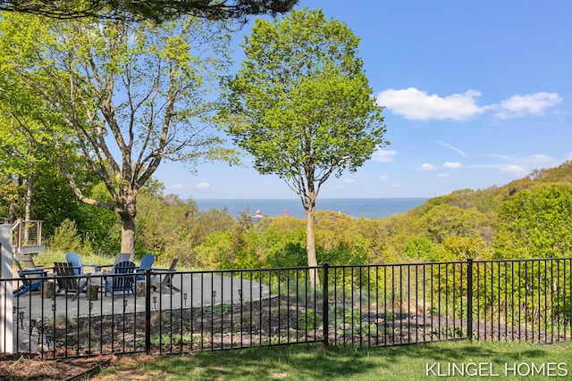 127 Emmet St, Grand Haven, MI 49417 - view of yard featuring a patio area, a water view, and a forest view