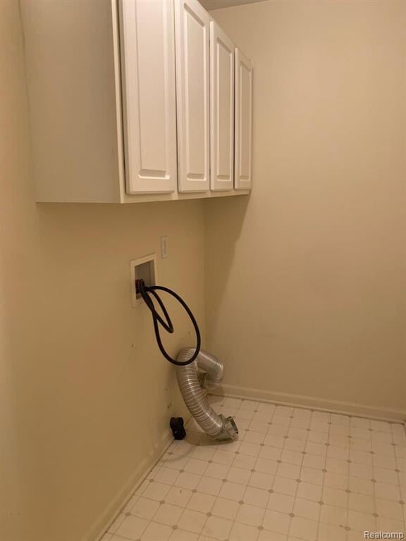 1240 University Dr Unit 2, Pontiac, MI 48342 - washroom with cabinet space, baseboards, and hookup for a washing machine