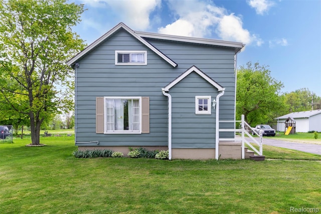 2433 Henry St, Port Huron, MI 48060 - view of property exterior featuring a lawn