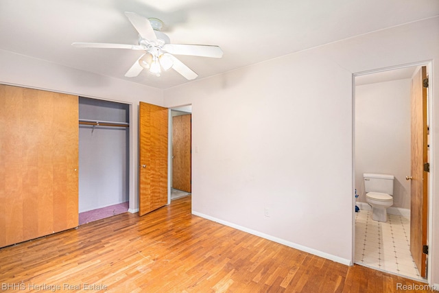3226 Glasgow Dr, Lansing, MI 48911 - unfurnished bedroom featuring light wood-style floors, a closet, ensuite bathroom, ceiling fan, and baseboards