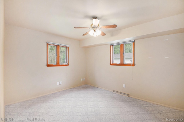 3226 Glasgow Dr, Lansing, MI 48911 - empty room with healthy amount of natural light, carpet, and ceiling fan