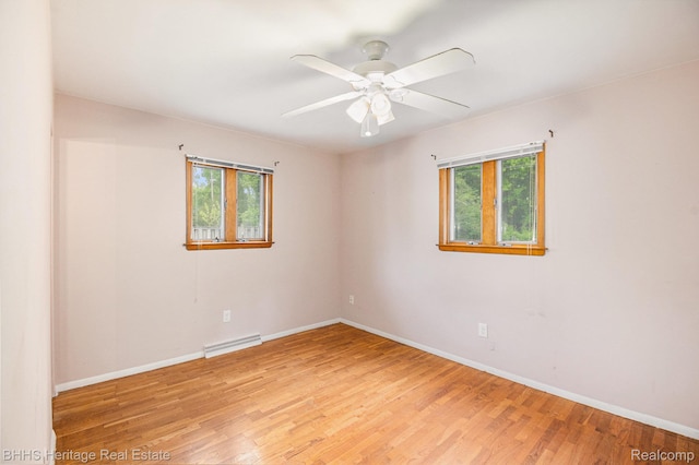 3226 Glasgow Dr, Lansing, MI 48911 - unfurnished room with plenty of natural light, light wood-style flooring, baseboards, and a ceiling fan