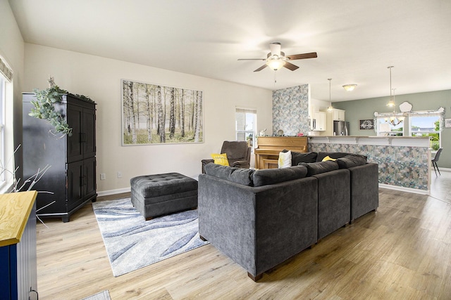 8825 Aveling Way, Richland, MI 49083 - living area featuring plenty of natural light, light wood-type flooring, and ceiling fan