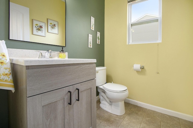 8825 Aveling Way, Richland, MI 49083 - half bath with baseboards, toilet, vanity, and tile patterned flooring