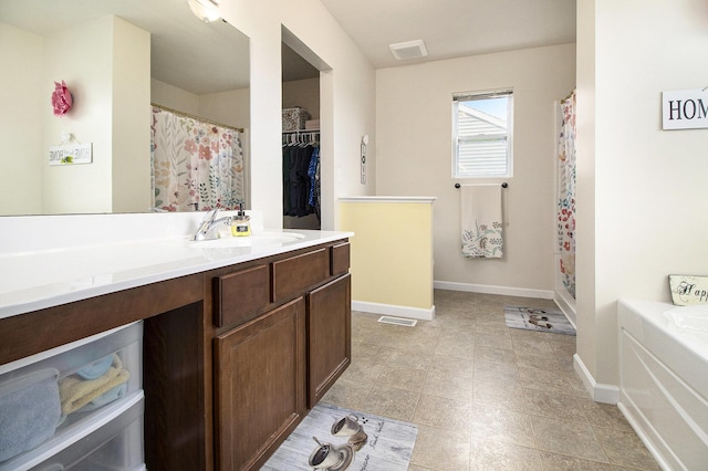 8825 Aveling Way, Richland, MI 49083 - bathroom featuring baseboards, vanity, curtained shower, tile patterned floors, and a tub