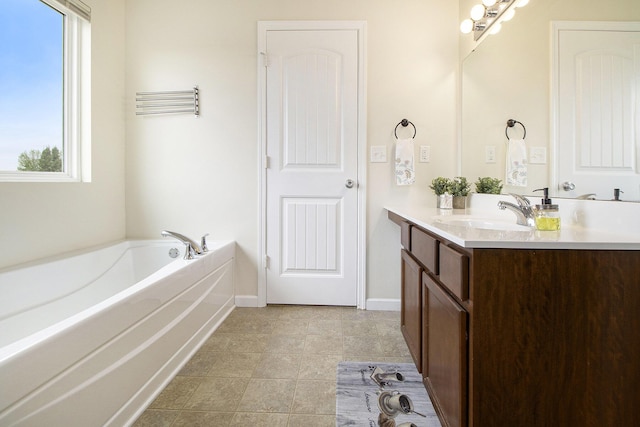 8825 Aveling Way, Richland, MI 49083 - bathroom featuring vanity, a bath, and baseboards
