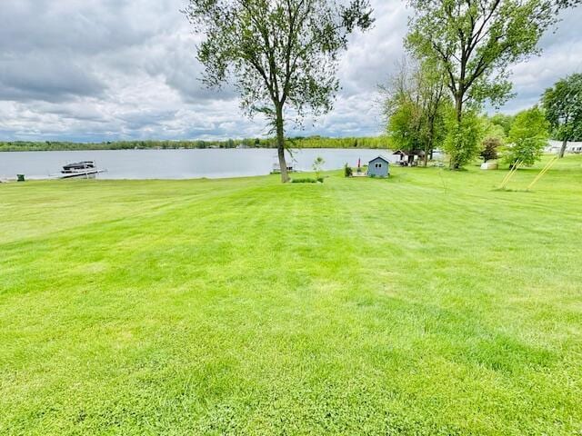 1022 Ottland Shrs, Lake Odessa, MI 48849 - view of grassy yard featuring a water view