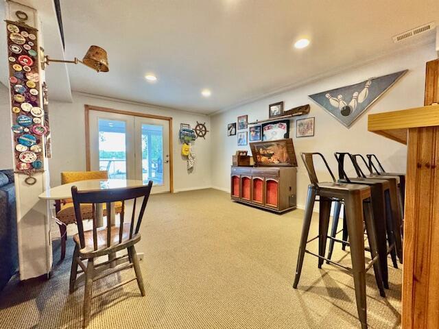 1022 Ottland Shrs, Lake Odessa, MI 48849 - carpeted dining space with french doors, recessed lighting, and baseboards