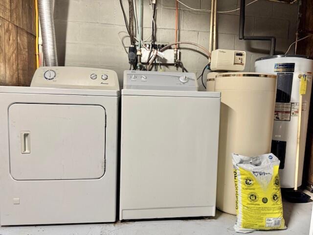 1022 Ottland Shrs, Lake Odessa, MI 48849 - washroom with separate washer and dryer, electric water heater, and concrete block wall