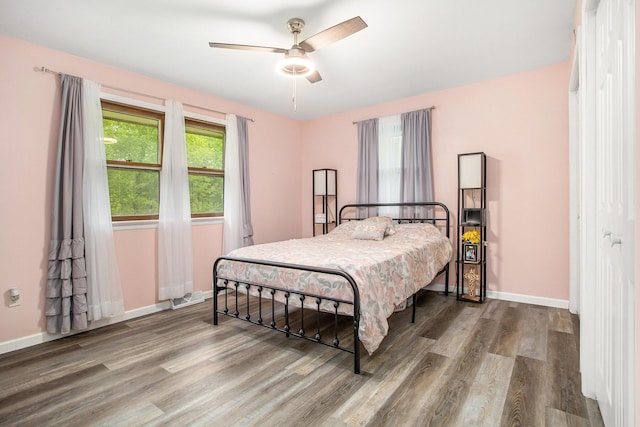 7920 8 1/2 Mile Rd, Ceresco, MI 49033 - bedroom featuring wood finished floors, baseboards, and a ceiling fan