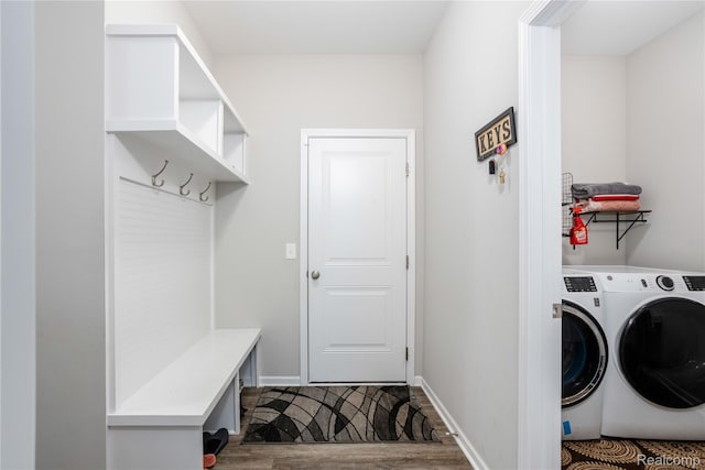 132 Copper Ridge Ct, Walled Lake, MI 48390 - laundry room with independent washer and dryer and dark wood-style flooring