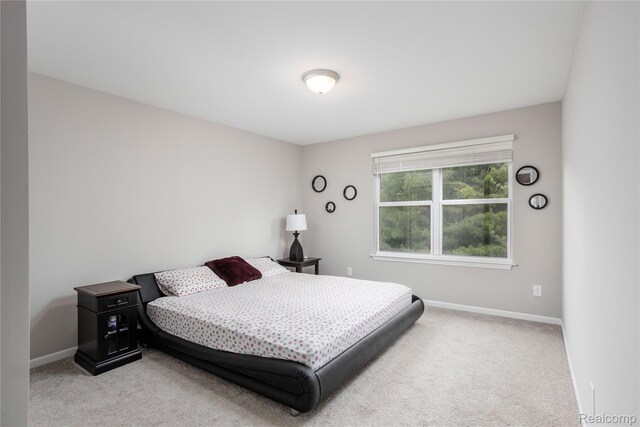 132 Copper Ridge Ct, Walled Lake, MI 48390 - carpeted bedroom featuring baseboards
