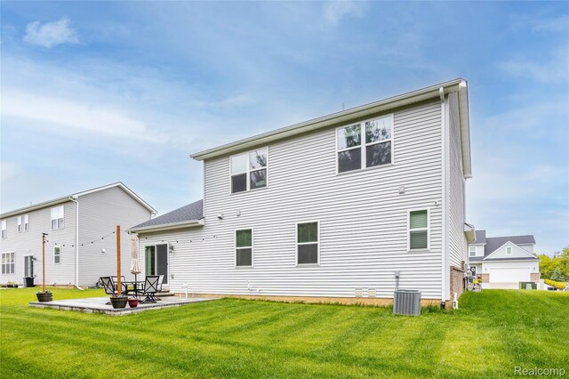 132 Copper Ridge Ct, Walled Lake, MI 48390 - back of house with a lawn, a patio, and central AC