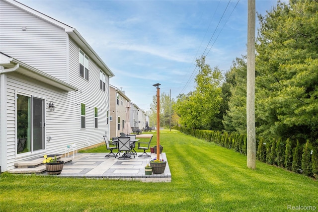 132 Copper Ridge Ct, Walled Lake, MI 48390 - view of green lawn with a patio area