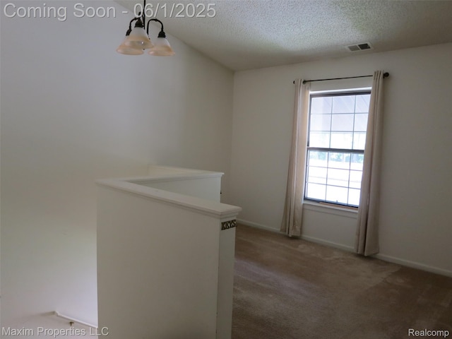 35707 Hunter Ave Unit 8, Westland, MI 48185 - unfurnished room with a chandelier, a textured ceiling, carpet floors, and baseboards