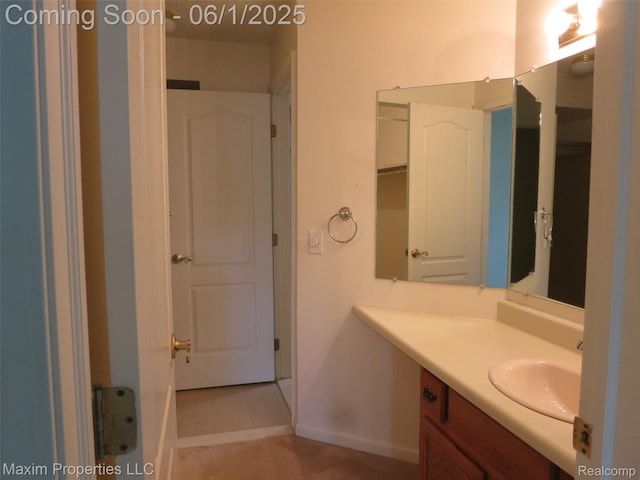35707 Hunter Ave Unit 8, Westland, MI 48185 - bathroom featuring vanity, tile patterned floors, and baseboards