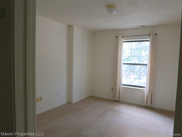 35707 Hunter Ave Unit 8, Westland, MI 48185 - empty room with light carpet and a textured ceiling